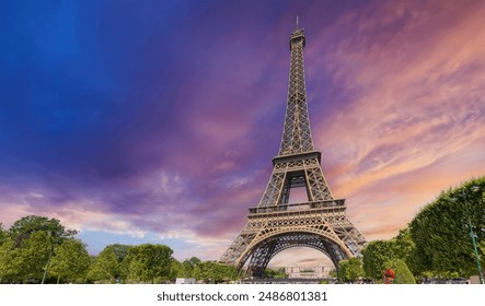 World famous Eiffel tower under a pink sky at sunset. Paris, France