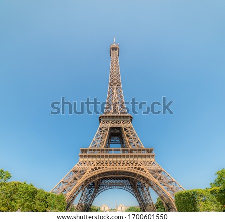 Similar – Eiffel Tower in green trees on blue sky