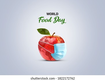 World Food Day Concept. World Food Day Corona Concept- An Apple With Face Mask. Food Day Conceptual Background.