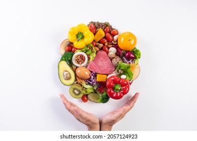 World food day, vegetarian day, Vegan day concept. Top view of woman hand covering fresh vegetables, fruit on white paper background.