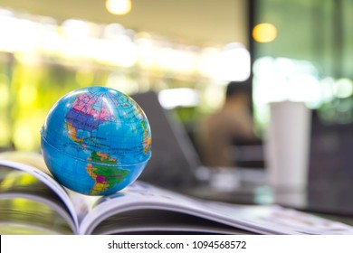 World Globe On Text Book.
Graduate Study Abroad Programs.    
International Education School Concept. 