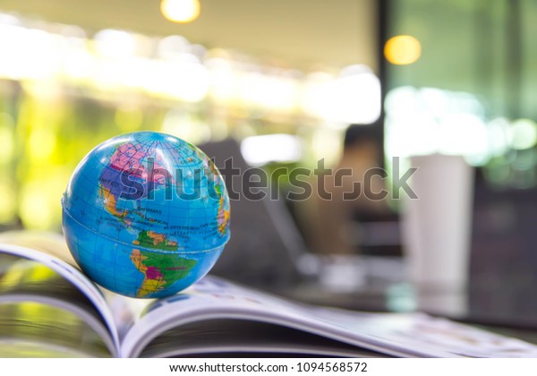 World globe on text book.
Graduate study abroad programs.    
International education school Concept. 