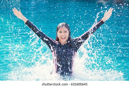 World Health Day Concept: Asian Woman Jumping On The Pool