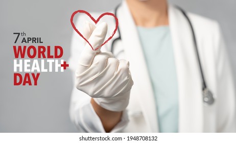 World Health Day A Global Health Awareness Day Celebrated Every Year On 7 April. A Doctor In White Gown Make A Mini Heart Hand Sign To Camera With Typography And Graphic Design.