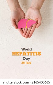 World hepatitis day. Adult hands holding donation liver on white background. Awareness of prevention and treatment viral hepatitis. Liver cancer. World cancer day. banner. vertically photo