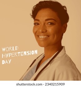 World hypertension day text by smiling african american female doctor over beige background. digital composite, awareness day, hypertension prevention, healthcare, medical professional, copy space. - Powered by Shutterstock