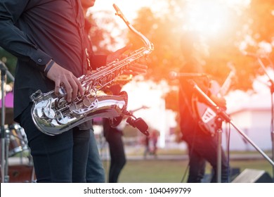World Jazz festival. Saxophone, music instrument played by saxophonist player and band musicians on stage in fest.