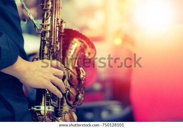 World Jazz festival. Saxophone,\
music instrument played by saxophonist player musician in\
fest.