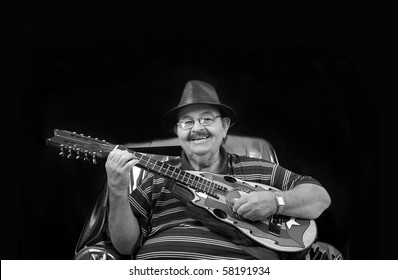   World Legend And Musician Yomo Toro.  Famous For Playing The Cuatro, A Small Guitar Like Instrument.