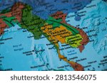 World map closeup with sharp focus on Cambodia. Wonderlust or tour or travel concept.