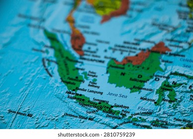 World map closeup with sharp focus on Java sea. Wonderlust or tour or travel concept.