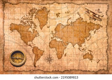 World Map with compass and wooden airplane