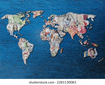 World map with continents made from money of different countries on blue background - Shutterstock ID 2281130083