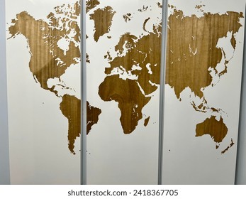 world map of the five continents, very well carved in wood, in three decorative paintings for interior decoration, white and brown color