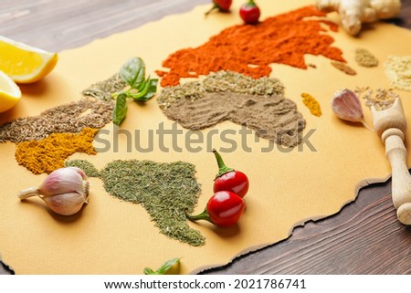World map made of different spices on table