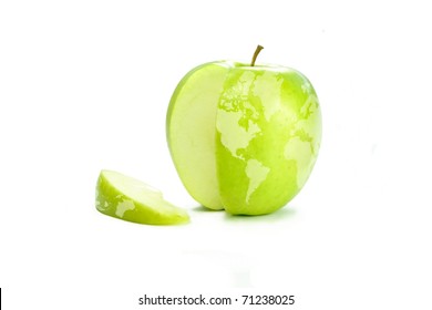 World map on a fresh green apple with a slice cut out illustrating travel, international business, world food.