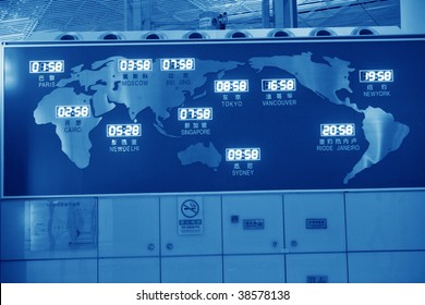 world map and time on wall in beijing airport