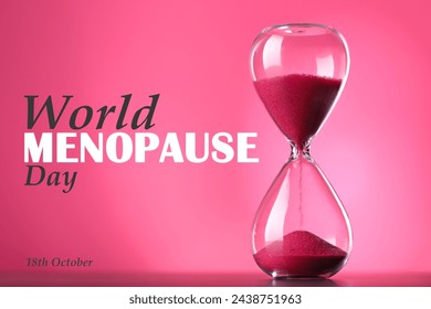 Día Mundial de la Menopausia - 18 de octubre. Reloj de arena con arena roja sobre fondo rosa brillante