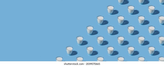 World Milk Day. Pattern on a blue background. A glass of milk. Sample. With space for text. copy space. Banner - Powered by Shutterstock