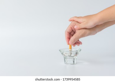 World No Tobacco Day, May 31. Stop Smoking.,Hand of father holding cigarettes, Hand of kid breaking hand of father before smoking cigarette, copy space.