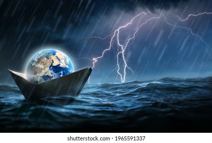 World In A Paper Boat Floating In The Ocean In A Middle Of A Storm. Faith Despite World Crisis And Hardship Conceptual Theme.