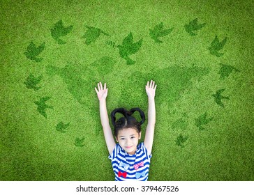 World peace day, international day of peace, and universal children's day concept with peaceful mind kid resting in clean natural environment on eco friendly world map green lawn - Powered by Shutterstock