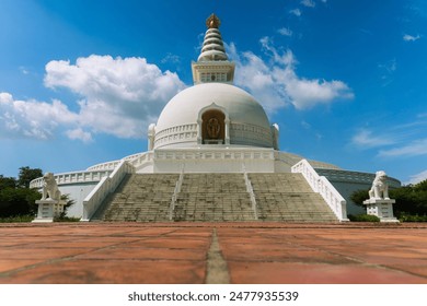 The World Peace Pagoda also called the Nipponzan Peace Pagoda, is a magnificent Buddhist monument in Lumbini, Nepal UNESCO world heritage site. It was designed and built by Japanese Buddhists.  - Powered by Shutterstock