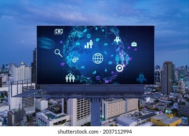 World planet Earth map hologram and social media icons on billboard over night panoramic city view of Bangkok, Southeast Asia. Networking and establishing new connections between people. Globe