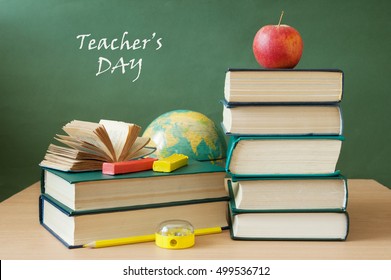 World Teacher's Day (still Life With Book Pile, Apple, Globe And Desk On Artistic Background)