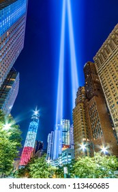 World Trade Center Lights And Freedom Tower At Night In Manhattan - American Flag Colors Of Red White And Blue On The Famous Skyscraper Commemorating September 11th