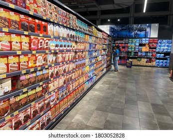 World Trade Centre Mall, Abu Dhabi, U.A.E. March 14th, 2020: Supermarket Shelves With Packed Food Items. Retail Shoppers At Retail Shopping Mall.