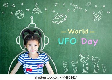 World UFO Day And Outer Space Week Education Concept Idea With Girl Kid In Astronaut Chalk Drawing On Teacher's Chalkboard