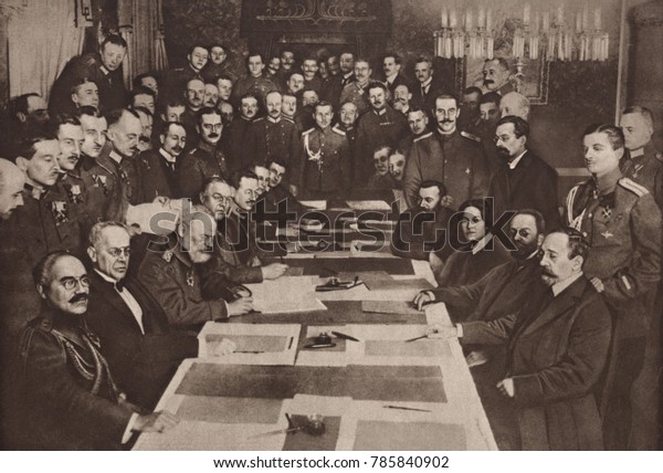 World War 1. The Bolshevik government of Russia
signs a separate peace with Central Powers (Austria, Germany,
Turkey) at Brest-Litovsk on March 3, 1918. Seated around the table,
L-R: Zeki Pasha, couns