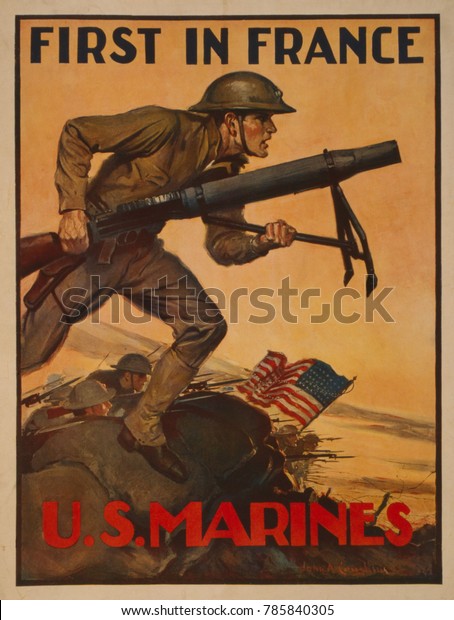 World War 1. First in France--U.S. Marines. 1917\
recruiting poster showing a Marine carrying a mortar into combat. A\
symbolic group of Marines arrived in France in July 1917, but most\
American soldier