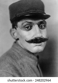 World War 1. French Soldier, Whose Face Was Disfigured In World War I, Wearing A Mask Of Sculpted And Painted Copper Made By American Artist Anna Coleman Ladd. July 1918.