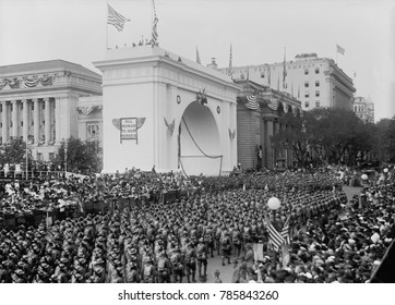 World War 1 victory parade passing a Triumphal Arch, in New York City, Sept. 10, 1919. The First Division of American Expeditionary Forces wearing trench helmets and full combat gear, marched down Fif