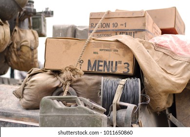 World war 2 era ration packs in boxes on an armoured vehicle from the same period. - Shutterstock ID 1011650860