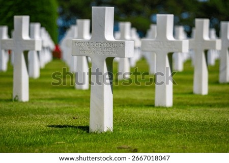 World War 2 Graveyard in Normandy - Cross Shaped head stones lined up in tribute to fallen Soldiers 