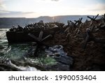 World War 2 reenactment (D-day). Creative decoration with toy soldiers, landing crafts and hedgehogs. Battle scene of Normandy landing on June 6, 1944. Selective focus