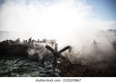 World War 2 reenactment (D-day). Creative decoration with toy soldiers, landing crafts and hedgehogs. Battle scene of Normandy landing on June 6, 1944. Selective focus - Shutterstock ID 2133193867
