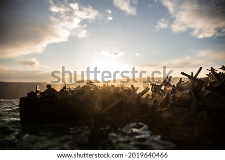 World War 2 reenactment (D-day). Creative decoration with toy soldiers, landing crafts, and hedgehogs. Battle scene of Normandy landing on June 6, 1944. Selective focus