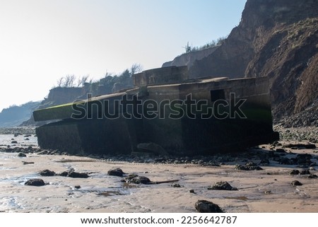 World War Two defence bunkers, fallen into the sea at Warden Point, Isle of Sheppey, Swale, Kent, UK.