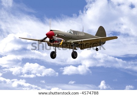 A World War Two U.S. Army Air Corps Curtiss P40 fighter aircraft landing.