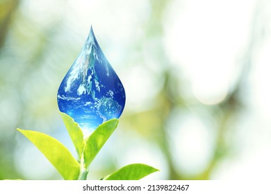 World Water Day And Global Warming Concept. Leaves Holding Earth In Water Drop Shape Green Bokeh Background. Copy Space On Horizontal Sheet. Elements Of This Image Furnished By NASA