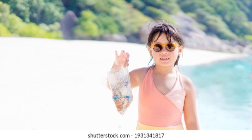 World Water Day, Save The Sea, Save The Earth, Kid Girl Volunteer Hands Holding Plastic Bag Waste On The Beach.Climate Change, Environmental CSR Corporate Social Responsibility Concept .Ecology Ocean.