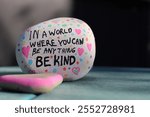 In a world where you can be anything be kind kindness rock