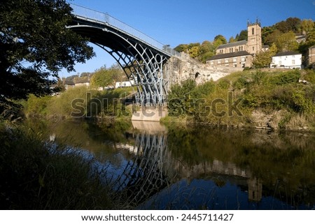 Worlds first iron bridge spans the banks of the River Severn in autumn sunshine, Ironbridge, UNESCO World Heritage Site, Shropshire, England, United Kingdom, Europe