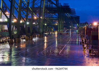 The World's Largest Container Port, Singapore. Heavy Rain, Cargo Operation By Night