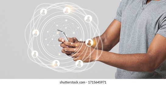 Worldwide Connection Technology Interface. Black Man Using Smart Phone With Icons And Hologram, Panorama