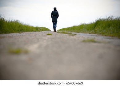 Worms Eye View Woman Walking Away